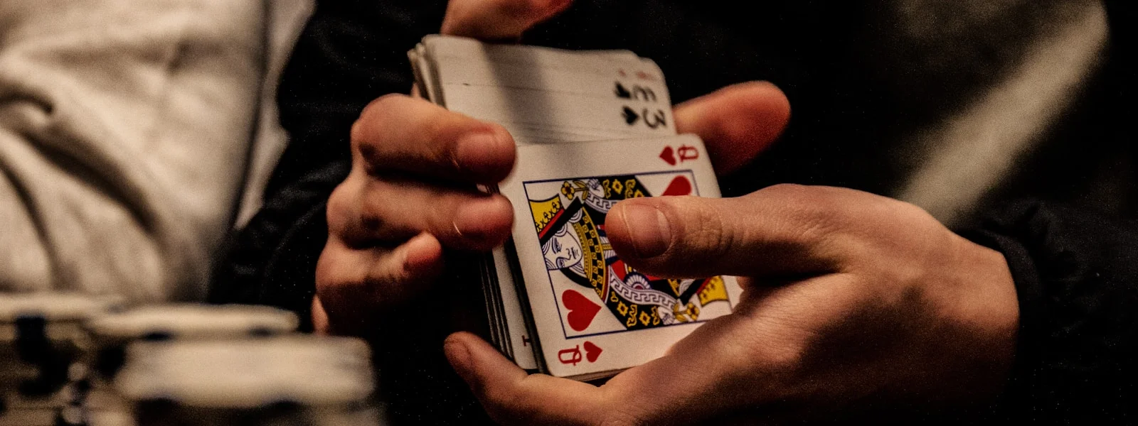 person holding king of spade playing card